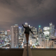 Illustration for article titled People tip toeing on top of buildings over cities will always be scary